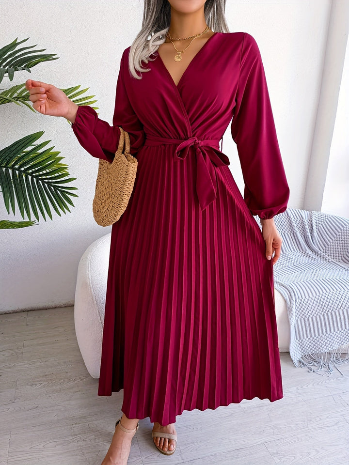 Camille - Elegant pleated dress with long sleeves and crossover neckline